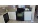 Modern kitchen with granite countertops and stainless steel appliances, including a dishwasher, oven, and microwave at 2831 E Waltann Ln # 1, Phoenix, AZ 85032