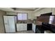 Bright kitchen features white cabinetry, granite countertops, and modern appliances at 2831 E Waltann Ln # 1, Phoenix, AZ 85032