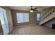 Living room features tile flooring, staircase, and windows with natural light at 2831 E Waltann Ln # 1, Phoenix, AZ 85032