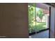 Cozy room with a large window overlooking lush greenery and neighborhood scenery at 2831 E Waltann Ln # 1, Phoenix, AZ 85032