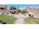 Outdoor entertainment with fire pit, seating area, desert landscaping, and privacy fence at 29839 N Little Leaf Dr, San Tan Valley, AZ 85143