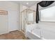 Bathroom featuring a shower, a large tub, and neutral decor, next to a window for natural light at 29839 N Little Leaf Dr, San Tan Valley, AZ 85143