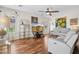Comfortable living room featuring hardwood floors, stylish décor, and ample natural light for relaxing at 29839 N Little Leaf Dr, San Tan Valley, AZ 85143