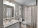 Bathroom features a white vanity, large mirror, toilet, and shower-tub combination at 3236 E Chandler Blvd # 2018, Phoenix, AZ 85048