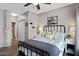Bedroom showcases a ceiling fan, closet, ensuite bathroom, and stylish decor at 3236 E Chandler Blvd # 2018, Phoenix, AZ 85048