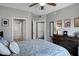 Bedroom features stylish furniture, decor, a closet, and ensuite bathroom at 3236 E Chandler Blvd # 2018, Phoenix, AZ 85048