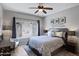 Bedroom with Southwestern-themed decor, ceiling fan, and a window overlooking the desert landscape at 3236 E Chandler Blvd # 2018, Phoenix, AZ 85048