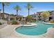 Stunning community pool with crystal clear blue water and tropical landscaping at 3236 E Chandler Blvd # 2018, Phoenix, AZ 85048
