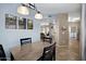 Open dining room with modern light fixture, tile flooring and neutral colors at 3236 E Chandler Blvd # 2018, Phoenix, AZ 85048