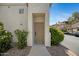 Inviting condo entrance with desert landscaping and covered doorway at 3236 E Chandler Blvd # 2018, Phoenix, AZ 85048