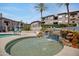 Inviting hot tub with waterfall features surrounded by lush landscaping at 3236 E Chandler Blvd # 2018, Phoenix, AZ 85048