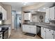 Kitchen featuring white cabinets, granite countertops, stainless steel appliances, and an open design at 3236 E Chandler Blvd # 2018, Phoenix, AZ 85048