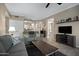 Spacious living room with tile floors, comfortable seating, and natural light at 3236 E Chandler Blvd # 2018, Phoenix, AZ 85048