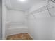 Spacious walk-in closet featuring built-in wire shelving and neutral-toned flooring at 3236 E Chandler Blvd # 2018, Phoenix, AZ 85048