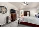 Bedroom with neutral tones, a ceiling fan, an en-suite bathroom, and carpeted floors at 3301 S Goldfield Rd # 1048, Apache Junction, AZ 85119