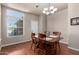 Cozy dining room featuring hardwood floors and a classic chandelier at 3301 S Goldfield Rd # 1048, Apache Junction, AZ 85119