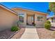 Inviting front entrance with desert landscaping and a paved walkway at 3301 S Goldfield Rd # 1048, Apache Junction, AZ 85119