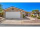 Charming single-story home features a two-car garage and low maintenance desert landscaping at 3301 S Goldfield Rd # 1048, Apache Junction, AZ 85119
