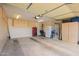 Spacious two car garage with built in shelving and plenty of space at 3301 S Goldfield Rd # 1048, Apache Junction, AZ 85119