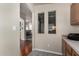 Hallway with arched entryway featuring a view of the living area and kitchen at 3301 S Goldfield Rd # 1048, Apache Junction, AZ 85119
