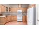Kitchen with light wood cabinets, modern appliances, and spacious countertops at 3301 S Goldfield Rd # 1048, Apache Junction, AZ 85119