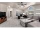 Open living room features a vaulted ceiling, modern fan, and plush carpeting at 3301 S Goldfield Rd # 1048, Apache Junction, AZ 85119
