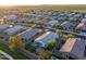 A high aerial of the home and neighborhood, offering a glimpse of the community layout and nearby open fields at 36033 W Catalonia Dr, Maricopa, AZ 85138