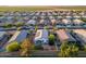 Overhead aerial of home showcasing the backyard, trampoline, solar panels, landscaping, and neighborhood proximity at 36033 W Catalonia Dr, Maricopa, AZ 85138