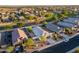 A beautiful aerial view showing the roof and surrounding community with lush green spaces, and easy access to roads at 36033 W Catalonia Dr, Maricopa, AZ 85138