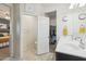 Bathroom featuring dual sinks, with a view of the toilet room and closet at 36033 W Catalonia Dr, Maricopa, AZ 85138