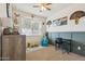 Cozy bedroom with a large window, playful decor, and ample natural light for a cheerful ambiance at 36033 W Catalonia Dr, Maricopa, AZ 85138
