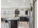 Modern kitchen featuring granite countertops, stainless steel appliances, and a large kitchen island at 36033 W Catalonia Dr, Maricopa, AZ 85138