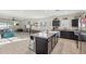 Open-concept kitchen and living area, great for entertaining, and lots of natural light at 36033 W Catalonia Dr, Maricopa, AZ 85138