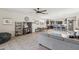 Open living area with a view of the kitchen, featuring an island with bar seating and tile flooring at 36033 W Catalonia Dr, Maricopa, AZ 85138