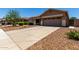 Single Gathering home with low maintenance desert landscaping and large driveway at 3719 E Sandy Way, Gilbert, AZ 85297