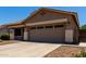 Single story home with desert landscaping, two-car garage, and stylish architectural details at 3719 E Sandy Way, Gilbert, AZ 85297