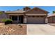 Charming single-story home featuring a low maintenance desert landscape and a two-car garage at 3719 E Sandy Way, Gilbert, AZ 85297