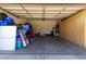 A two-car garage with a water heater and built-in storage cabinets along the right wall at 3719 E Sandy Way, Gilbert, AZ 85297