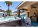 Relaxing backyard features a hot tub and patio with easy access to pool at 3719 E Sandy Way, Gilbert, AZ 85297