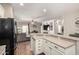 Open-concept kitchen area with breakfast bar overlooking the living room area at 3719 E Sandy Way, Gilbert, AZ 85297