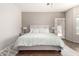 Bright main bedroom featuring a ceiling fan, plush bed, and stylish decor at 3719 E Sandy Way, Gilbert, AZ 85297