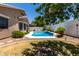Inviting backyard pool features a small waterfall feature and easy access to home at 3719 E Sandy Way, Gilbert, AZ 85297