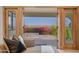 Balcony view with mountain views, bougainvillea, and natural light coming through sliding glass doors at 3800 E Lincoln Dr # 31, Phoenix, AZ 85018