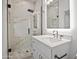 Bathroom featuring glass shower, marble style tile and modern fixtures at 3800 E Lincoln Dr # 31, Phoenix, AZ 85018