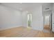 Bedroom with bright wood floors and access to updated bathroom at 3800 E Lincoln Dr # 31, Phoenix, AZ 85018