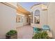 Comfortable outdoor seating area with a bright table and chairs for relaxing and entertaining guests at 3800 E Lincoln Dr # 31, Phoenix, AZ 85018