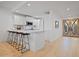 Well-lit kitchen with stainless steel appliances, bar seating, and ample counter space, perfect for cooking at 3800 E Lincoln Dr # 31, Phoenix, AZ 85018