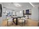 Open-concept kitchen with bar seating, black table, and modern finishes, creating a cozy atmosphere at 3800 E Lincoln Dr # 31, Phoenix, AZ 85018