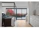 A bright main bedroom features a four-poster bed, outdoor access, and elegant decor creating a calming and inviting space at 3800 E Lincoln Dr # 31, Phoenix, AZ 85018