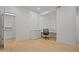 Bright office space with built-in desk, drawers, and wood-look floors at 3800 E Lincoln Dr # 31, Phoenix, AZ 85018